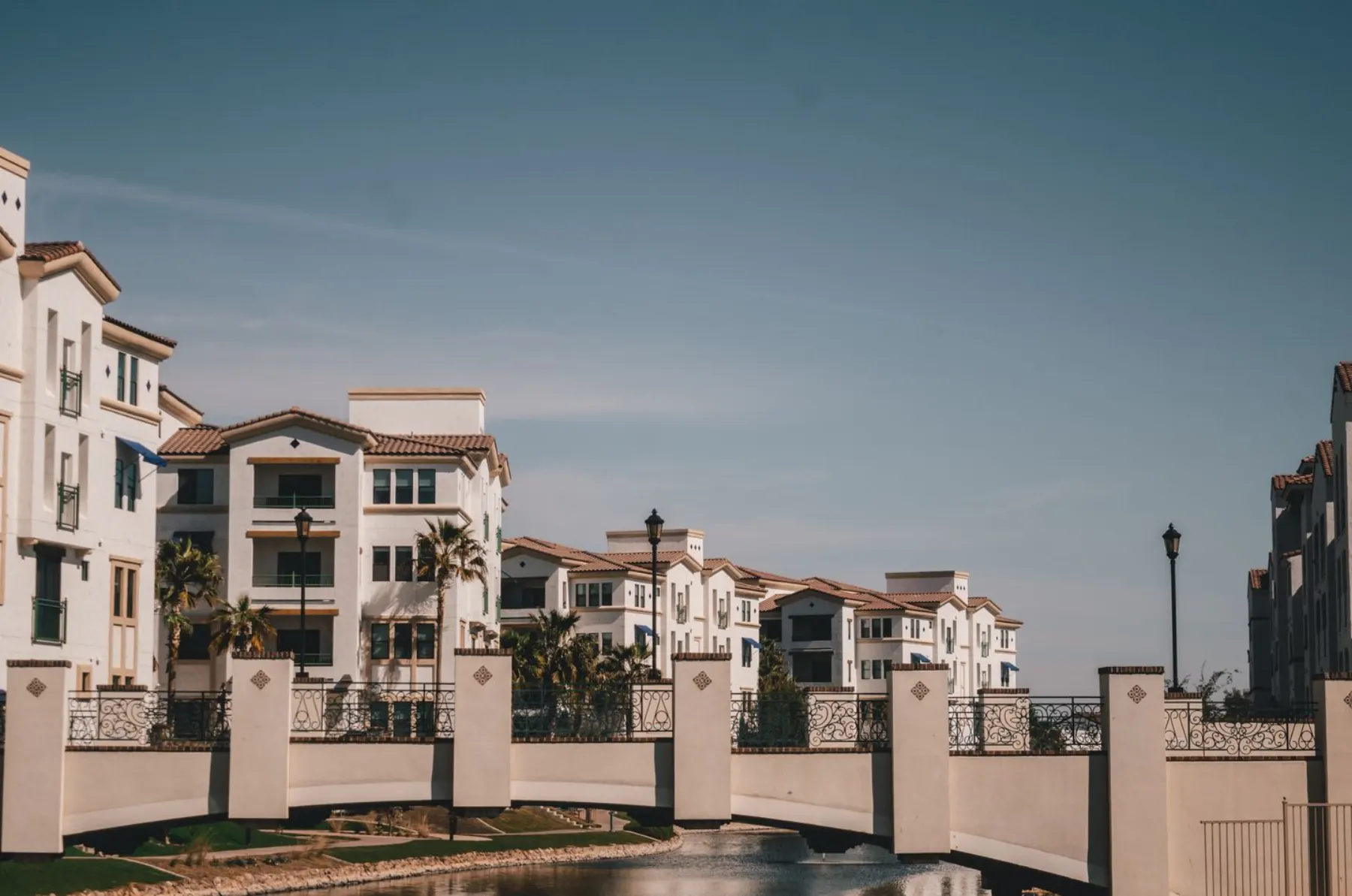 Newer stucco apartment buildings with tile roofs in Chandler, Arizona